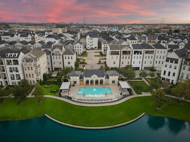 aerial view at dusk with a water view