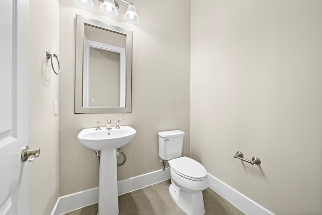 bathroom with toilet and sink