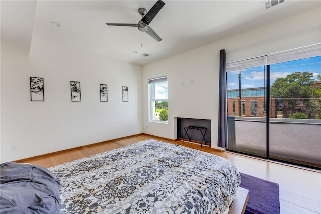 bedroom with ceiling fan and light hardwood / wood-style flooring