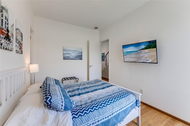 bedroom featuring wood-type flooring