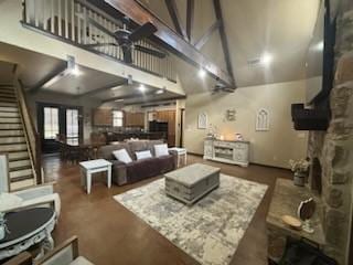 living room featuring high vaulted ceiling and ceiling fan