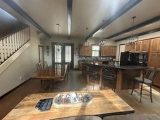 dining area with beam ceiling