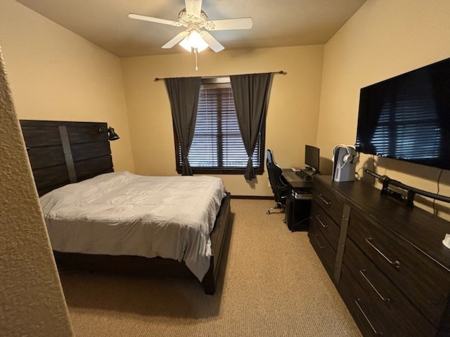 bedroom with light carpet and ceiling fan