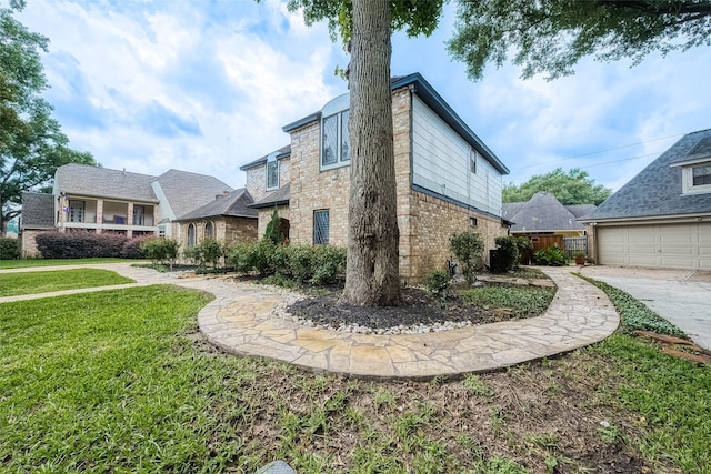 view of property exterior featuring a garage and a lawn