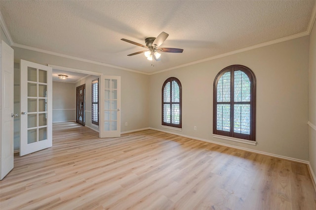 empty room featuring french doors, light hardwood / wood-style flooring, and ceiling fan