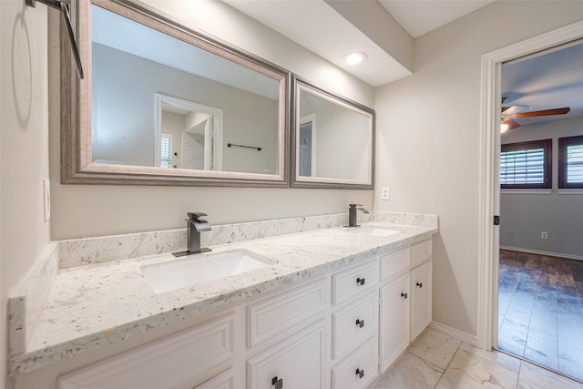 bathroom featuring ceiling fan and vanity