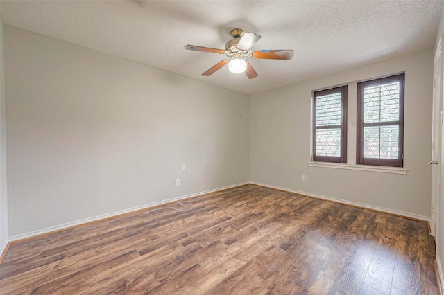 spare room featuring a textured ceiling, dark hardwood / wood-style floors, and ceiling fan