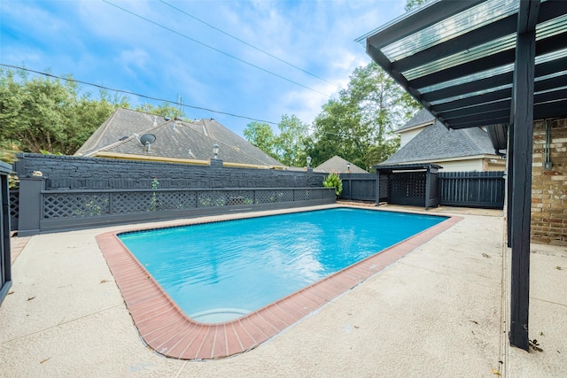 view of swimming pool with a patio area