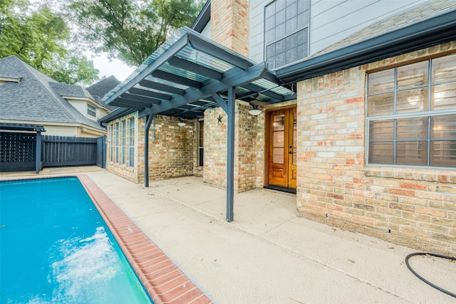 view of swimming pool featuring a patio area