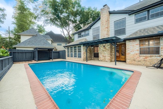 view of pool featuring a pergola, a patio, and french doors