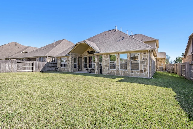 rear view of house with a lawn