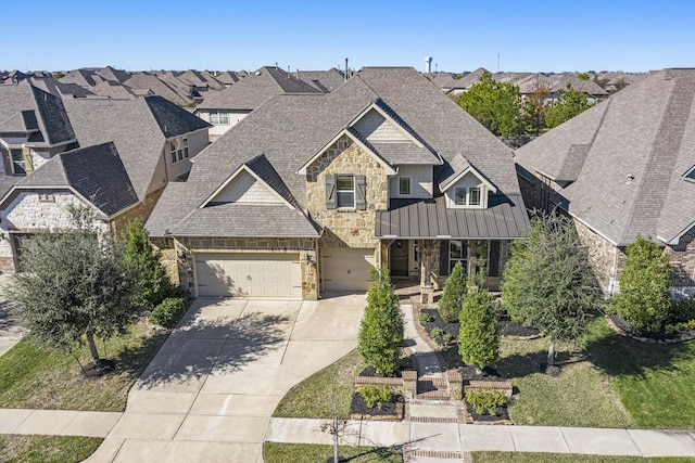 view of front of house featuring a porch and a garage