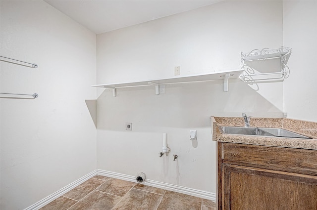 washroom featuring electric dryer hookup and sink