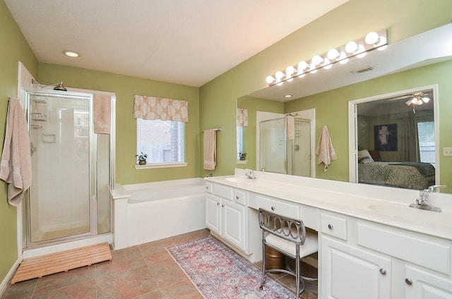 bathroom featuring tile patterned flooring, vanity, and plus walk in shower