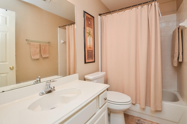 full bathroom featuring shower / bath combo, vanity, and toilet