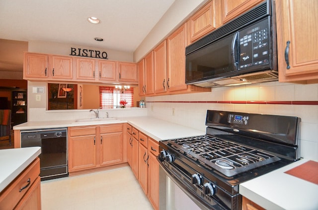 kitchen featuring black appliances and sink