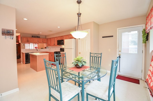 dining area with wine cooler and sink