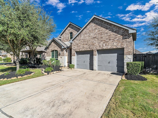 view of front of house featuring a front yard and a garage