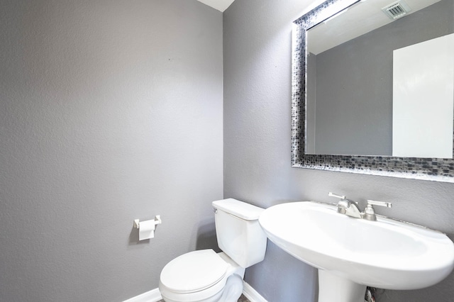 bathroom with sink and toilet