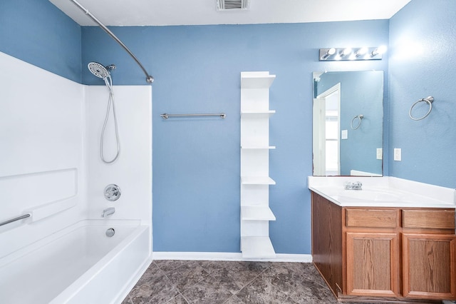 bathroom featuring bathtub / shower combination and vanity