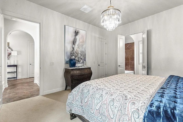 bedroom featuring carpet floors and a notable chandelier