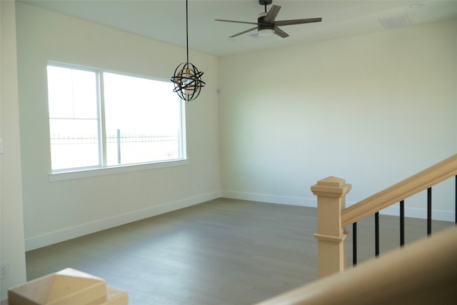 unfurnished room with hardwood / wood-style floors and ceiling fan