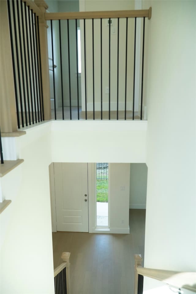 stairs with wood-type flooring