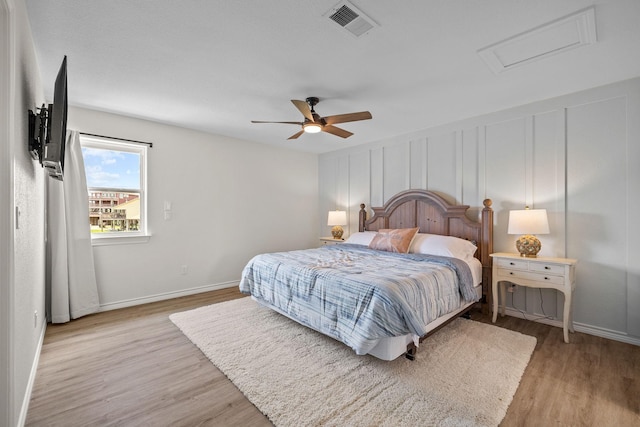 bedroom featuring ceiling fan and light wood-type flooring