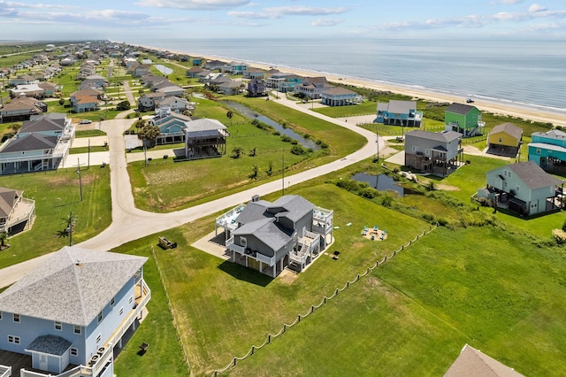 birds eye view of property featuring a view of the beach and a water view