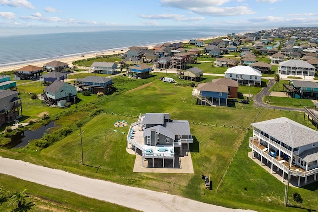 bird's eye view featuring a water view and a view of the beach