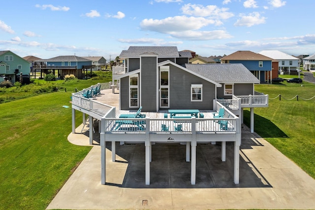 back of house with a lawn, a wooden deck, and an outdoor living space