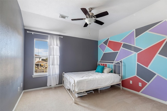 carpeted bedroom with ceiling fan