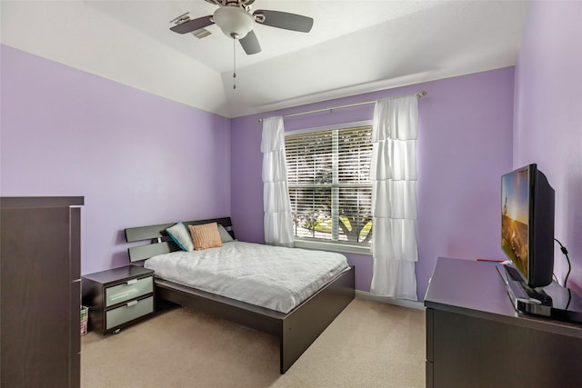 carpeted bedroom featuring ceiling fan and lofted ceiling