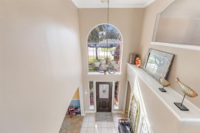 tiled entryway with a towering ceiling