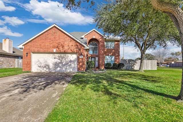 view of property featuring a garage and a front yard