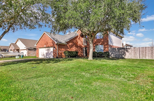 view of front facade featuring a front lawn and a garage