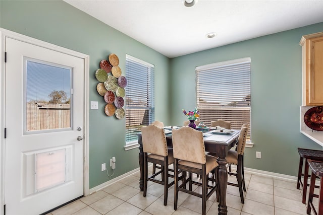 dining room with light tile patterned flooring