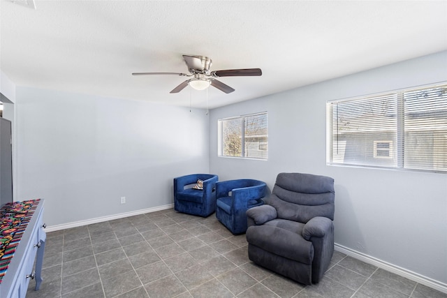 sitting room featuring ceiling fan