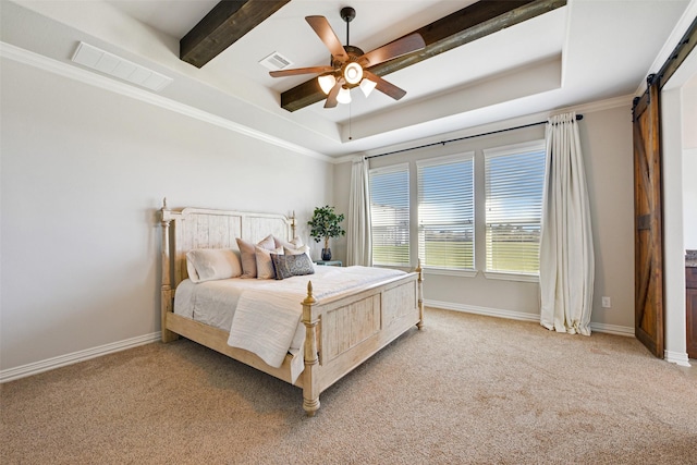 carpeted bedroom with a barn door, ceiling fan, a tray ceiling, and crown molding