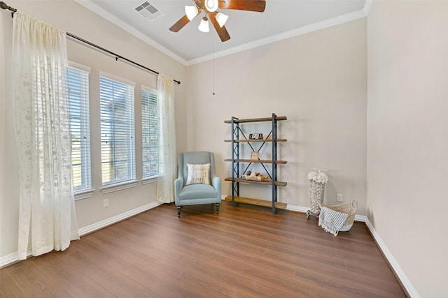 unfurnished room featuring crown molding, dark hardwood / wood-style floors, and ceiling fan