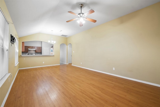 unfurnished living room featuring light hardwood / wood-style flooring, vaulted ceiling, and ceiling fan