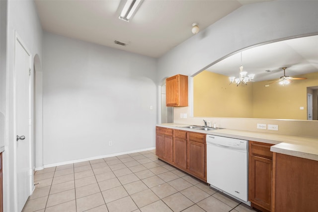 kitchen featuring ceiling fan with notable chandelier, sink, pendant lighting, dishwasher, and light tile patterned flooring