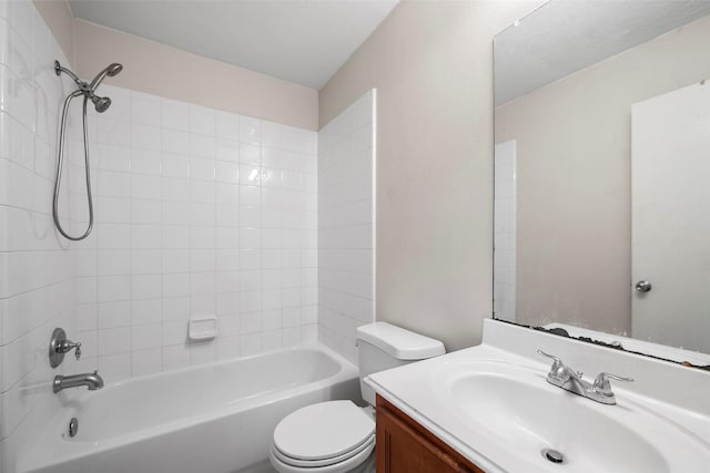 full bathroom with vanity, toilet, and tiled shower / bath