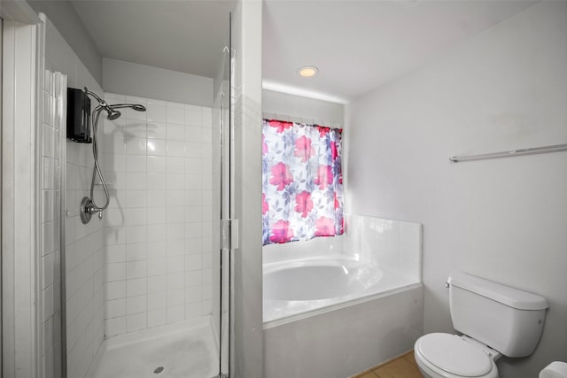 bathroom featuring shower with separate bathtub and toilet