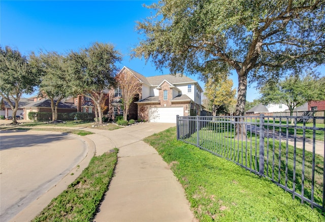 view of front of home featuring a front yard and a garage