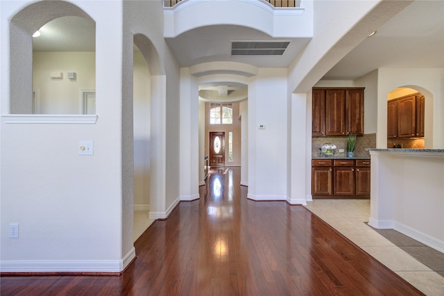 corridor with light hardwood / wood-style flooring