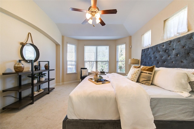 carpeted bedroom featuring ceiling fan and lofted ceiling