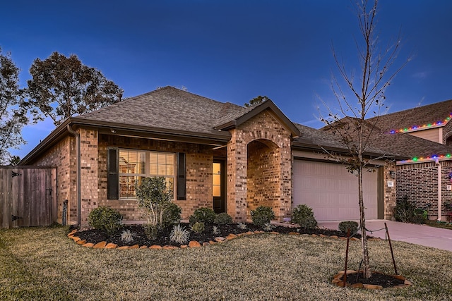 ranch-style house featuring a garage