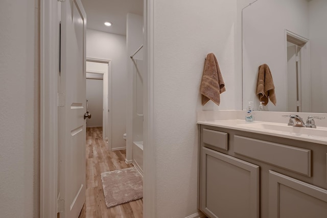 bathroom featuring vanity and wood-type flooring