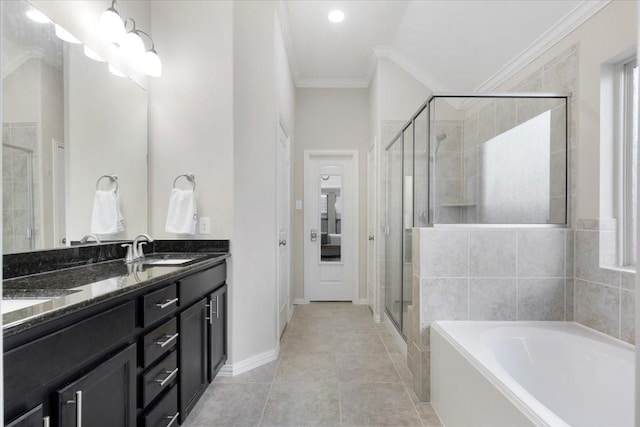 bathroom featuring separate shower and tub, tile patterned floors, vanity, and ornamental molding